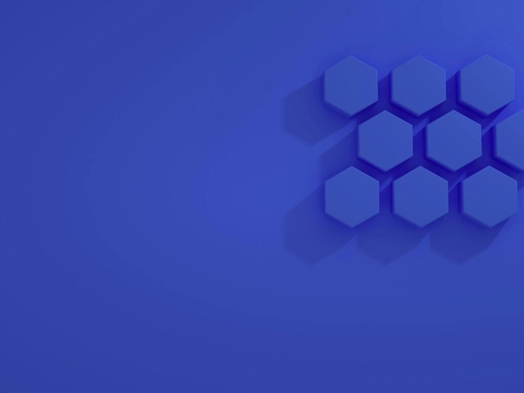 A minimalist abstract design featuring blue hexagons on a blue background.
